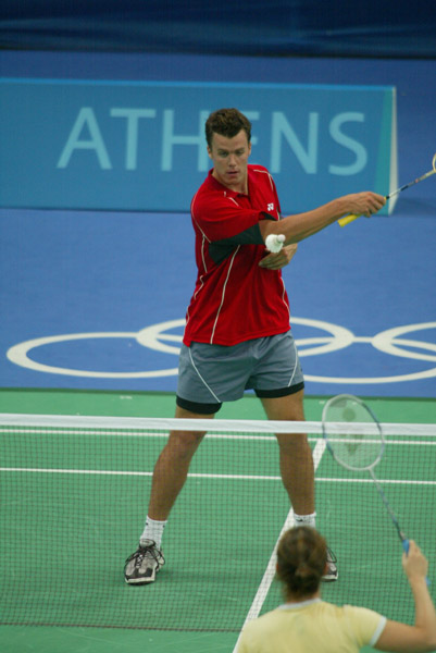 Philippe Bourret of Montreal, Quebec, hits the birdie during a badminton training for the summer Olympic Games in Athens, Greece, Tuesday, August 10, 2004. (CP PHOTO/COC-Mike Ridewood)