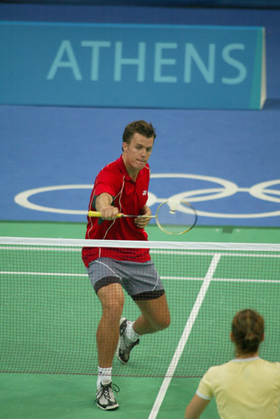 Philippe Bourret of Montral, Qubec, hits the birdie during a badminton training for the summer Olympic Games in Athens, Greece, Tuesday, August 10, 2004. (CP PHOTO/COC-Mike Ridewood)