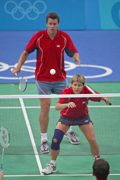 Mixed double team Philippe Bourret of Montreal and Denyse Julien of Calgary keep their eyes on the birdie during badminton training for the summer Olympics in Athens, Greece, Tuesday, August 10, 2004.  (CP PHOTO/COC-Mike Ridewood)
