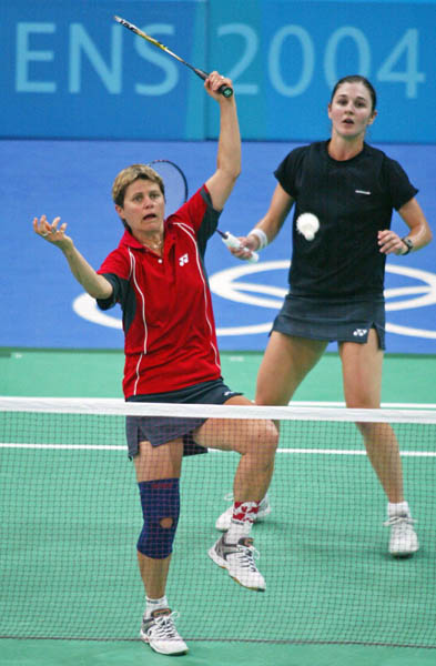 Women's doubles team Denyse Julien (front) of Calgary and Anna Rice of Vancouver return a shot during badminton training for the summer Olympics in Athens, Greece on Tuesday Aug. 10, 2004. (CP PHOTO/COC-Mike Ridewood)