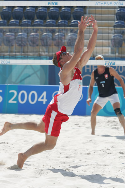 Mark Heese of Toronto goes for the ball in Canada's loss in beach volleyball at the Athens Olympics, Saturday, August 14, 2004. (CP PHOTO/COC-Mike Ridewood)