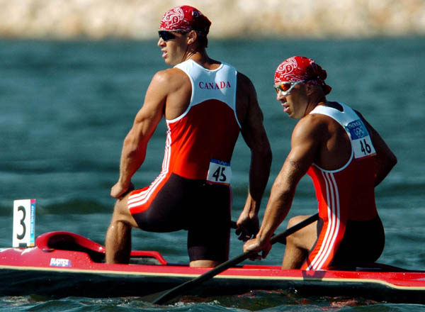 Canada's Buday brothers Attila (front) and Tamas react after finishing eighth during the C2 500m final at the Athens 2004 Summer Olympic Games Saturday, August 28, 2004. (CP PHOTO/COC-Andre Forget)