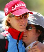 Canada's Alison Sydor (left) of Victoria is consoled by and unidentified friend after finishing fourth in women's mountain bike at the Athens Olympics, Friday, August 27, 2004.(CP PHOTO/COC-Mike Ridewood)