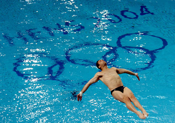 Philippe Comtois of Canada dives during training prior to the Athens 2004 Summer Olympic Games on Thursday Aug. 12, 2004. (CP PHOTO/Andre Forget/COC)