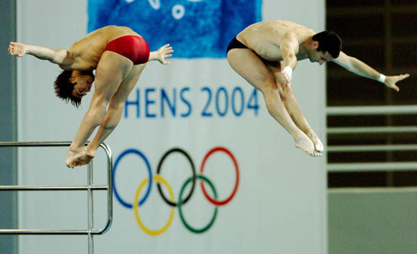 Alexandre Despatie and Philippe Comtois (left) of Canada dive during training prior to the Athens 2004 Summer Olympic Games August 12, 2004. (CP PHOTO 2004/Andre Forget/COC)