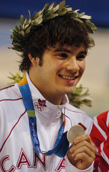Alexandre Despatie of Montreal, Quebec is all smiles after winning the silver medal during the mens 3m springboard at the Athens 2004 Summer Olympic Games August 24, 2004. (CP PHOTO 2004/Andre Forget/COC)