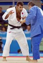 Canada's Catherine Roberge of Montreal leaves the gym after being eliminated from the women's 70-kilogram judo competition at the 2004 Summer Olympic Games  in Athens, Greece, Wednesday, Aug. 18, 2004. (CP PHOTO 2004/Andre Forget/COC)