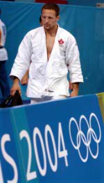 Canada's Catherine Roberge of Montreal leaves the gym after being eliminated from the women's 70-kilogram judo competition at the 2004 Summer Olympic Games  in Athens, Greece, Wednesday, Aug. 18, 2004. (CP PHOTO 2004/Andre Forget/COC)