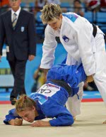Marie Helene Chisholm (right) of Varennes, Que. lost to Urska Zolnir of Slovakia in 63kg judo action at the Athens Olympics, Tuesday, August 17, 2004.  (CP PHOTO/COC-Mike Ridewood)