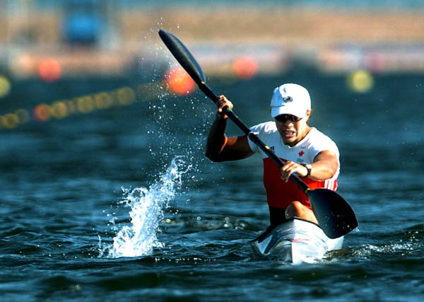 Canada's Caroline Brunet sits in her boat after crossing the finish line to win a bronze medal in the K1 500meter final at the Summer Olympics in Schinias, Greece, Saturday, August 28, 2004. (CP PHOTO/COC-Andre Forget)