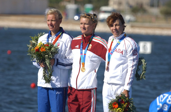 The three medallists in the women's K1 500m event at the Olympic Games in Athens, Hungary's Natasa Janics (gold), Italy's Josefa Idem (silver) and Canada's Caroline Brunet (bronze).  (CP PHOTO 2004/Andre Forget/COC)