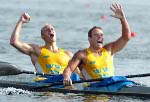Hungary's Botond Storcz (top) and team mate Akos Vereckei celebrate their teams gold medal win of the K4 1000m final during the Athens 2004 Summer Olympic Games on Friday, August 27, 2004. Canada's team came in ninth.  (CP PHOTO/COC-Andre Forget)