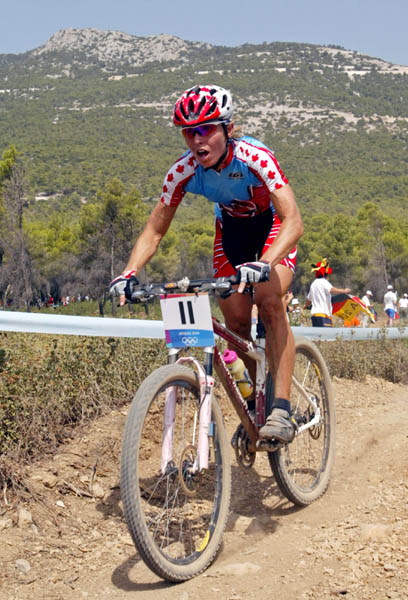 Canada's Marie-Helene Premont of Chateau-Richer, Que. pedals to the silver medal in women's mountain bikeaction at the Athens Olympics, Friday, August 27, 2004.(CP PHOTO/COC-Mike Ridewood)