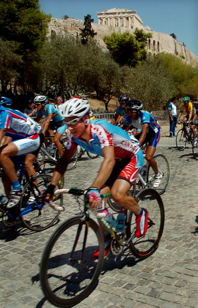 Eric Wohlberg of Canada races past the Acropolis during the road race of the Athens 2004 Summer Olympic Games Saturday August 14, 2004. (CP PHOTO/COC-Andre Forget)