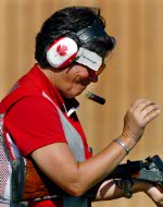 Canada's Linda Thom and her coach Joe Liota celebrate her gold medal win in the shooting event at the 1984 Olympic games in Los Angeles. (CP PHOTO/ COA/ Tim O'lett)