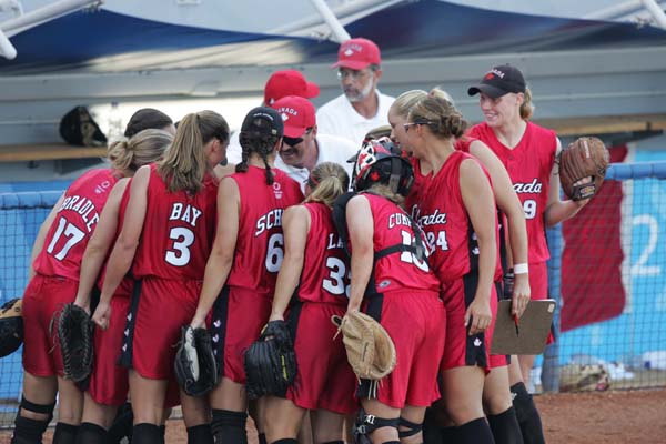 Canada's softball head coach, Mike Renney, gives the team his last instructions before the the preliminary game against Taipei on August 14, 2004 at the Olympic Games in Athens.  (CP PHOTO)2004(COC-Mike Ridewood)