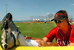 Erin White de Richmond, C-B, et Rachel Schill de Kitchener, Ontario, clbrent la victoire de l'quipe canadienne au softball contre Taiwan 2-0 aux Jeux olympiques  Athnes le samedi 14 aot 2004. (CP PHOTO/COC-Mike Ridewood)