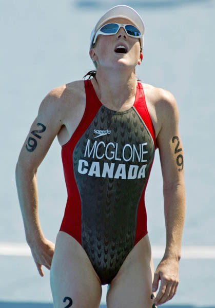 Canada's Samantha McGlone of Montreal, Quebec,  crosses the finish line 27th in the womens triathlon at the Summer Olympics in Athens Greece Wednesday Aug 25, 2004. (CP PHOTO/COC-Mike Ridewood)