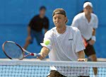 Frederic Niemeyer of Campbellton, N.B. in the first round of doubles tennis against Slovakia at the Olympic Games in Athens, Sunday, August 15, 2004. (CP PHOTO/COC-Mike Ridewood)