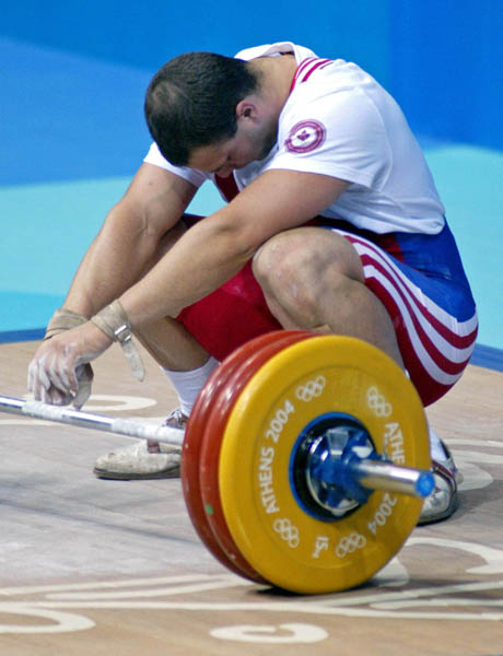 Canada's Akos Sandor of Mississauga, Ont. failed make his lift in the men's 105 kg. weightlifting  competition at the Athens Olympics, Tuesday, August 24, 2004. (CP PHOTO/COC-Mike Ridewood)