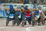 Canada's Chantal Petitclerc of Montreal on her way to the gold medal in women's wheelchair 800 metres in track and field action at the Athens Olympics, Sunday, August 22, 2004.(CP PHOTO/COC-Mike Ridewood)