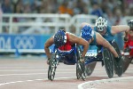 Canada's Chantal Petitclerc of Montreal on her way to the gold medal in women's wheelchair 800 metres in track and field action at the Athens Olympics, Sunday, August 22, 2004.(CP PHOTO/COC-Mike Ridewood)