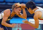 Canada's Lyndsay Belisle (left) of Burnaby, B.C., wrestles Chiharu Icho of Japan in the first match of women's 48kg. at the Athens Olympics Sunday, August 22, 2004.  Belisle lost the match. (CP PHOTO/COC-Mike Ridewood)