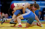 Canada's Viola Yanik (right) of Saskatoon wrestles Lili Meng of China in the first match of women's 63kg. at the Athens Olympics Sunday, August 22, 2004. Yanik lost the match. (CP PHOTO/COC-Mike Ridewood)
