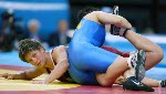 Canada's Viola Yanik (left) of Saskatoon wrestles Lili Meng of China in the first match of women's 63kg. at the Athens Olympics Sunday, August 22, 2004. Yanik lost the match. (CP PHOTO/COC-Mike Ridewood)