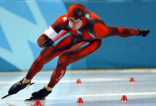 Canadian long-track speed skater Eric Brisson of Ste-Foy, Que. races during his 500-metre heat in Salt Lake City, Utah Tuesday Feb. 12, at the 2002 Olympic Winter Games. (CP Photo/COA/Andre Forget).