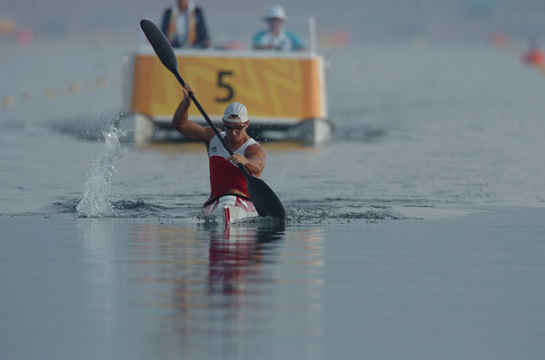 Canada's Adam van Koeverden of Burlington, Ontario paddles during the K1 1000m final during the Athens 2004 Summer Olympic Games in Schinias, Greece, on Friday, August 27, 2004. Van Koeverden came in third for a bronze medal. (CP PHOTO/COC-Andre Forget)