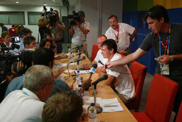 The canadian double medallist Adam van Koeverden meets the press with Canada's Chef de mission David Bedford on August 29, 2004.  Gold medallist in K1-500m and bronze medallist in K1-1000m, Adam van Koeverden was chosen to be the flagbearer at the closing ceremony of the Olympic Games in Athens.