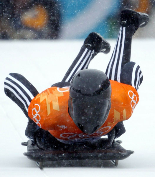 Canadian Men's skeleton rider Duff Gibson of Calgary jumps onto his sled during competition Wednesday Feb. 20, at the 2002 Olympic Winter Games in Salt Lake City. (CP Photo/COA/Andre Forget).