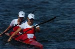 Canada's Caroline Brunet (left) and Mylanie Barre race during the K2 500m heat during the Athens 2004 Summer Olympic Games Tuesday August 24, 2004. The pair placed third in the heat.  (CP PHOTO/COC-Andre Forget)