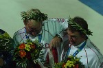 Les canadiens Ross MacDonald (gauche) de Vancouver, C-B, et Mike Wolfs (droite) de Port Credit, Ontario, se dirigent vers le podium pour recevoir leur mdaille d'argent remporte  l'preuve de voile star aux Jeux olympiques d't 2004  Athnes le samedi 28 aot 2004.(CP PHOTO 2004/Andre Forget/COC)