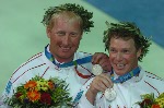 Les canadiens Ross MacDonald (gauche) de Vancouver, C-B, et Mike Wolfs (droite) de Port Credit, Ontario, se dirigent vers le podium pour recevoir leur mdaille d'argent remporte  l'preuve de voile star aux Jeux olympiques d't 2004  Athnes le samedi 28 aot 2004.(CP PHOTO 2004/Andre Forget/COC)