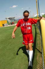 Canada's Kristy Odamura stretches before a practice game against Australia on August 11, 2004 at the Olympic Games in Athens. (CP PHOTO 2004/Andre Forget/COC)