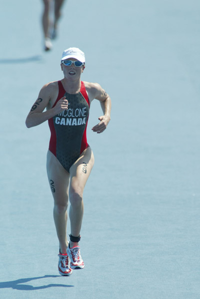 Canada's Samantha McGlone of Montreal, Quebec, crosses the finish line 27th in the women's triathlon at the Summer Olympic Games in Athens, Greece, on Wednesday Aug 25, 2004. (CP PHOTO/COC-Mike Ridewood)