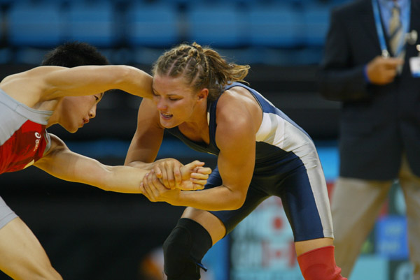 Canada's Lyndsay Belisle (blue) of Burnaby, B.C., wrestles Chiharu Icho of Japan in the first match of women's 48kg at the Olympic Games in Athens Sunday, August 22, 2004. Belisle lost the match. (CP PHOTO/COC-Mike Ridewood)