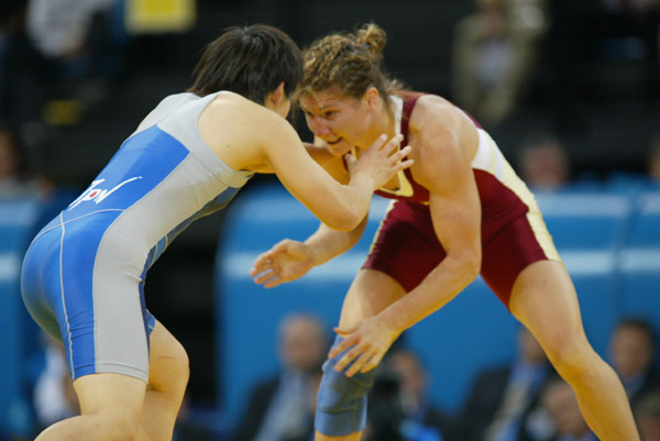 Canada's Tonya Verbeek of Beamsville, Ont., (red) fights Saori Yoshida of Japan at 55 kg. in women's wrestling finals at the Olympic Games in Athens, Monday, August 23, 2004. Verbeek lost the match and claimed the silver medal. (CP PHOTO)2004(COC-Mike Ridewood)