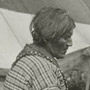Photograph of an Aboriginal woman, Betsy, seated in front of a tent, New Brunswick House, July 1906