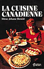 Cover of cookbook, LA CUISINE CANADIENNE, with a photograph of Madame Benoit seated at a table covered with food