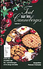 Cover of cookbook, TOUT SUR LES CANNEBERGES, black, with a strip of cranberry and a round photograph of cranberry pie, biscuits, bread, sauce and juice