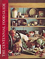 Cover of cookbook, THE CENTENNIAL FOOD GUIDE: A CENTURY OF GOOD EATING, COMPRISING AN ANTHOLOGY OF WRITINGS ABOUT FOOD AND DRINK OVER THE PAST HUNDRED YEARS, with a photograph of shelves filled with various kinds of food and cooking utensils