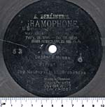 Seven-inch black disc with the HMV symbol etched in the grooves, circa 1900