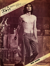 Image of a magazine cover featuring a black and white photograph of Mick Jagger on stage, holding a microphone