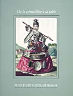 Cover of cookbook, DE LA CRÉMAILLÈRE À LA TABLE : USTENSILES DE LA CUISINE ET D'ÂTRE, TROIS SIÈCLES D'ARTISANAT, with an illustration of a woman wearing a dress made of different kinds of tin dishes