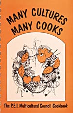 Cover of cookbook, MANY CULTURES, MANY COOKS: THE P.E.I. MULTICULTURAL COUNCIL COOKBOOK, with  a framed illustration various foods formed into a wreath shape