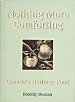 Cover of cookbook, NOTHING MORE COMFORTING: CANADA'S HERITAGE FOOD, with a linocut print of two apples on a branch